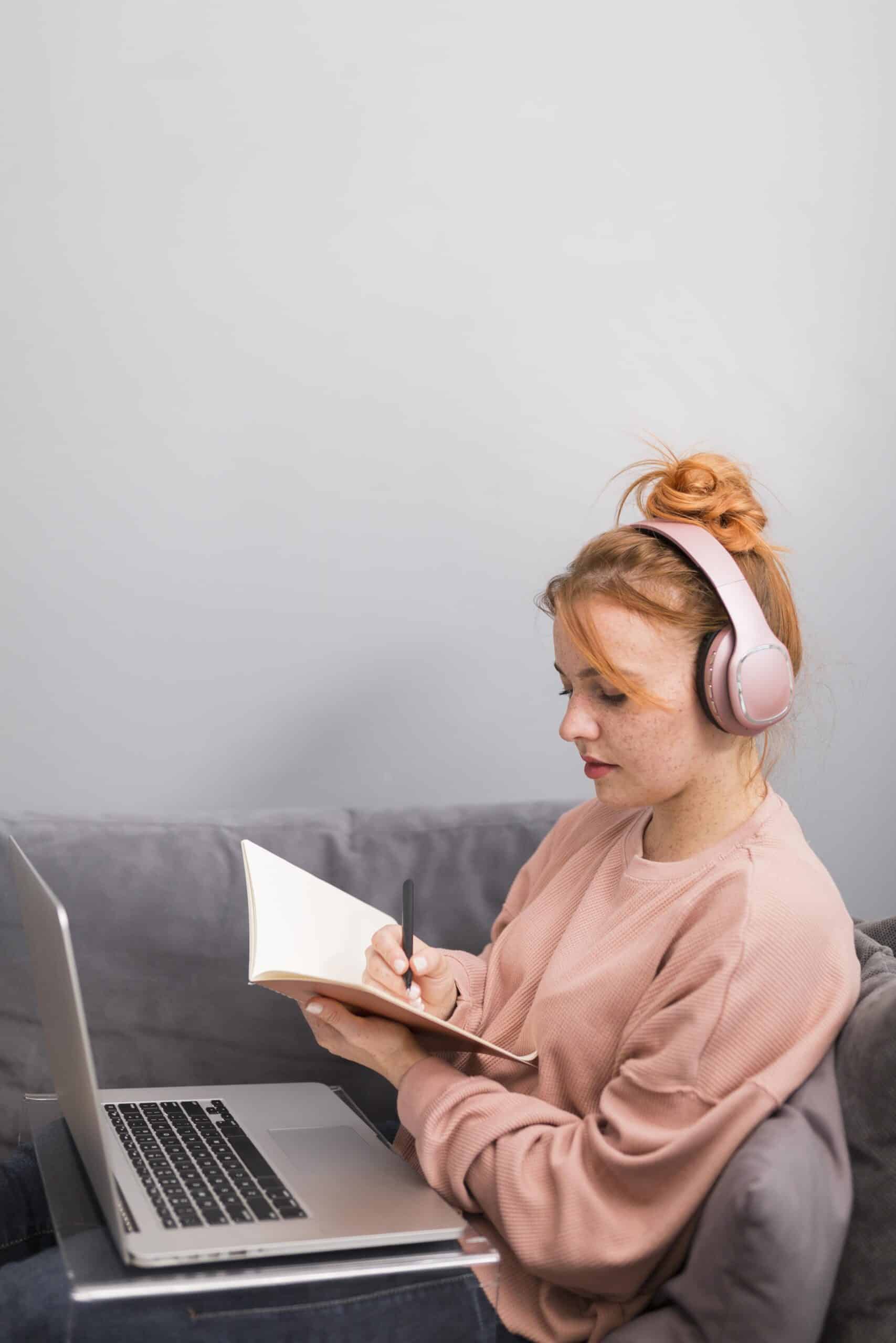 side-view-female-teacher-with-agenda-laptop-during-online-class